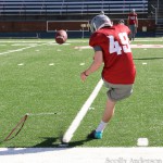 #49 B. Schafer practices kicks.