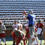 #4 L. Falk grabs a high snap.