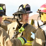 Firefighters discuss patient care.