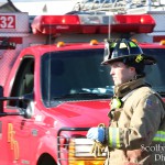 Firefighter Joe Branson in front of Rescue 32.