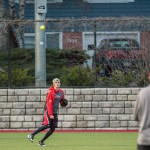 Garrett throws a ball in from the outfield.