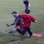 Drew Nordi catches the ball thrown to him at first base for the out.