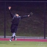 A member of the team Scared Hitless catches a long flyball hit by Danny Jones.