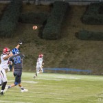 #12 Konner Kinkade throwing a pass on the run.