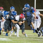 #52 Hayden Muraszewski helping with a tackle.