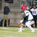 Moscow's quarterback handles a low snap.