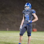 #19 James Pitzer watches from the backfield as the team gets in the victory formation for the final snaps of the game.